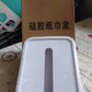 Silicone tissue holder being folded to showcase its flexibility.