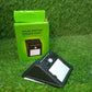 AutoSafeo black solar LED security light installed in a garden setting.