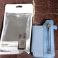 Slim profile of the adhesive phone wallet holder attached to a phone.