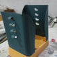 Household expandable garbage bin in blue and orange, designed for convenient waste management.