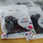A bundled group of vibrant small hairbands, demonstrating their compact size and elasticity for secure hold.