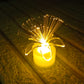 Several fiber optic LED centerpieces scattered for event lighting.