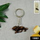 Close-up of the intricate walking lion design on metal keychain