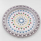 Decorative silver plated pooja thali with a polished finish, reflecting cultural heritage.