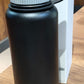 Compact black vacuum insulated stainless steel water bottle