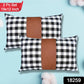 Close-up of a stylish leather and cotton cushion cover with intricate texture.