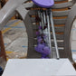 Detailed view of the top hanging ring and bamboo structure of the wind chime.