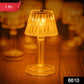 The mini crystal table lamp illuminating a modern living room setting.