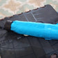 A hand holding the DrizzlePro 3-fold umbrella, illustrating its ergonomic design and convenient size.