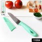 Kitchen knife with mint green ergonomic soft grip handle beside cutting board