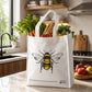Bee print handbag filled with groceries in kitchen