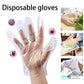 Bulk packaging of disposable clear gloves, showing multiple packs inside a larger box.