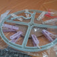 Laundry drying rack with clothespin clips hanging near window