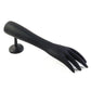 Jewelry pieces displayed elegantly on black hand-shaped stand