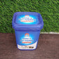 A metal oven rack being cleaned with the powerful oven cleaner powder and a sponge.