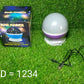 The Star Projector Night Lamp, side view, on a table.