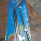 Hand holding a glass with an eco-friendly bent stainless steel straw, promoting sustainable living in India.