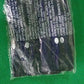 Comparison shot showing the compact size of the deflated velvet travel pillow.