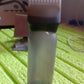 Front view of the professional hair comb applicator bottle, ready for use.
