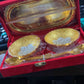 Artistic shot highlighting the craftsmanship of the gold and silver plated brass serving set elements.