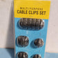 Multi-purpose wire holder in black, ideal for home and office cable solutions.