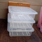 Side view of clear plastic food storage container with removable draining tray