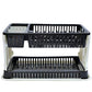 Black plastic dish drying rack with water collection tray on a kitchen counter.