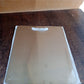 Durable stainless steel cutting board with handle, perfect for home kitchens