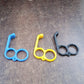 Close-up of hook-style plastic mobile holder stand with universal fit