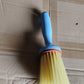 Multi-purpose plastic cleaning brush designed for kitchen and bathroom scrubbing