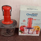 Quickslice manual food chopper ready for use, highlighting its robust stainless steel blades.