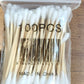 Eco-friendly cotton swabs packaging highlighting biodegradable wooden stems