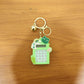 Frog calculator keychain displayed attached to a bag as a cute charm