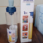 Elegant oil dispenser bottle standing upright on a kitchen counter, blending with modern decor.
