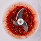 Chili inside stainless steel blade of garlic chopper