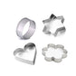 Four stainless steel cookie cutters in heart, star, round, and flower shapes on a white surface.