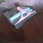 Close-up of the efficient cleaning brush head with integrated squeegee blade.