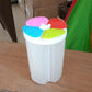 An empty Organivo 4 section kitchen storage jar, showing its clear plastic and the internal dividers for versatile organisation.