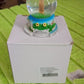 Another angle of the decorative snow globe, showcasing its appeal as a unique gift item.