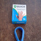 Lifestyle image of a person using the Acupressure Clip for natural pain relief while working.