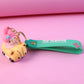 Cartoon character keychain with silicone strap and mini toy charm