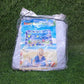 Portable and deflated Baby Water Mat, showcasing its compact storage for travel.