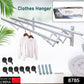 Extended stainless steel drying rack holding towels and clothes, showcasing its capacity.
