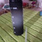 The black motivational water bottle placed on a clean background, emphasizing its design features.
