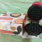 Mini waffle maker cooking freshly made waffles