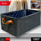 Foldable storage box holding neatly folded clothes, demonstrating practical closet organization.