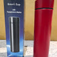 Red smart water bottle in a lifestyle setting for gym or travel use.