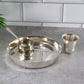 Durable stainless steel round thali plate from the dining set.