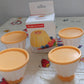 Retail packaging of the pudding molds set, emphasizing its quality and contents.