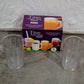 Clear plastic handled tumblers arranged for a picnic, highlighting their outdoor suitability.